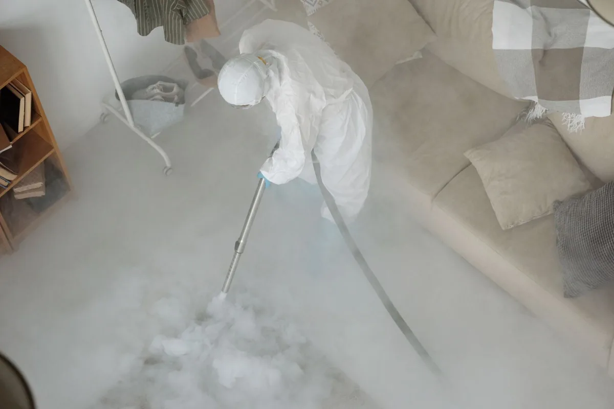 Biohazard cleanup technician in protective equipment, Fort Madison, IA